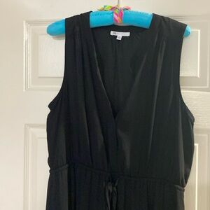 Sleeveless black maxi dress with side slits.